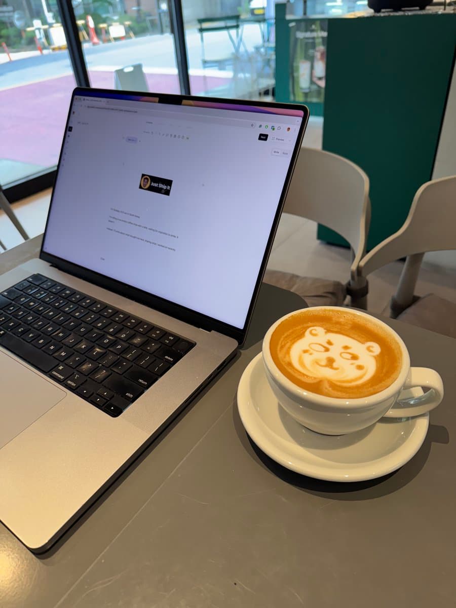 Iโm grinding at a cafe with coffee and a laptop